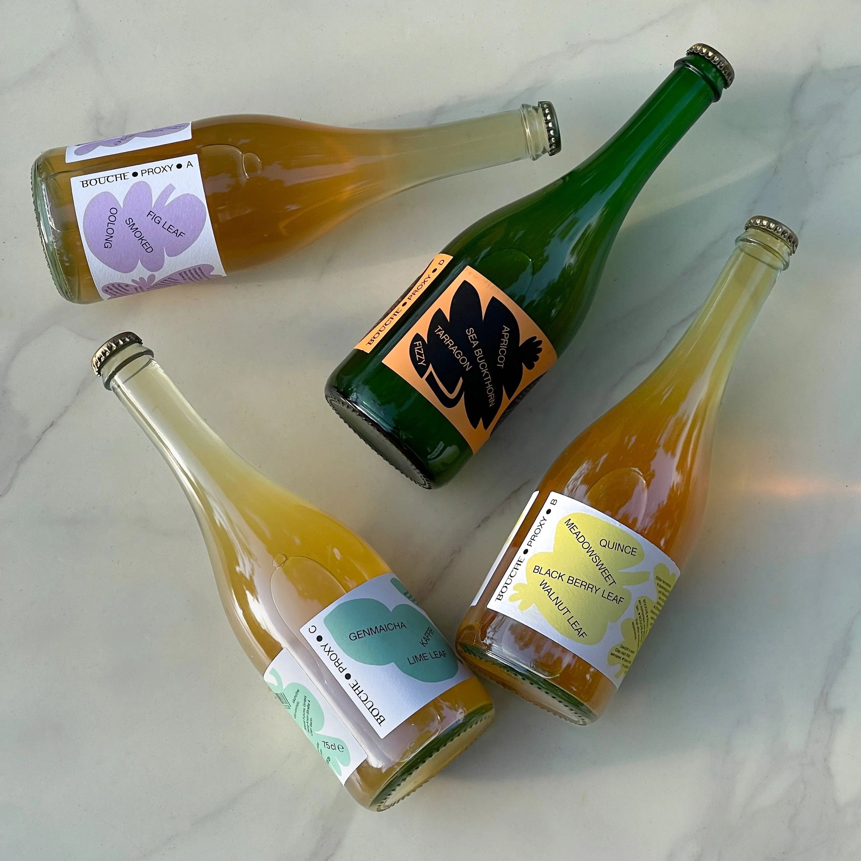 Photograph of PROXY A, B, C, and D, on a marble table.